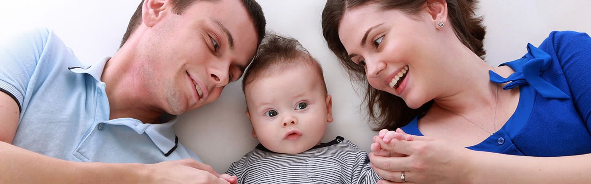 Mum, dad and baby | Benefits of Osteopathy at Holmwood Clinic