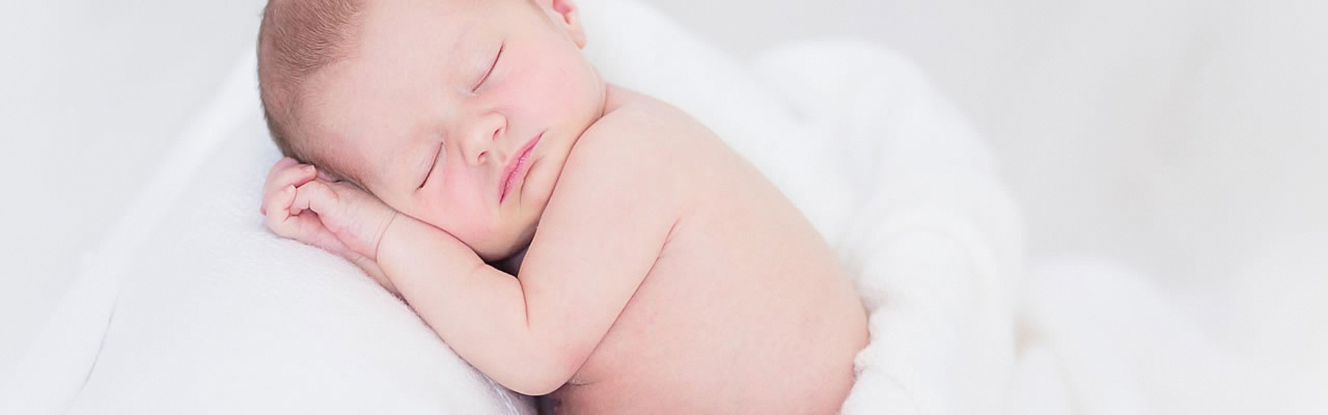 A sleeping baby | Breast feeding guidance from Holmwood Clinic
